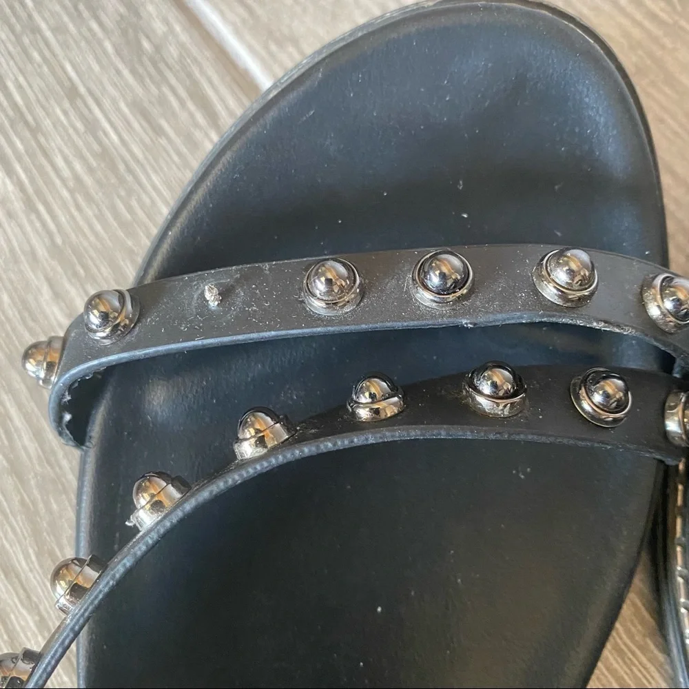 Black leather sandals with spikes